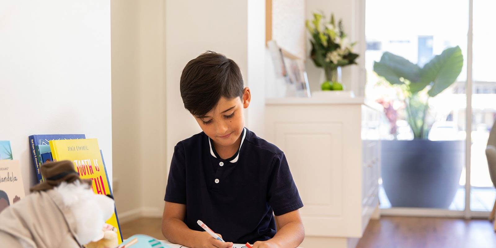 Young boy writing