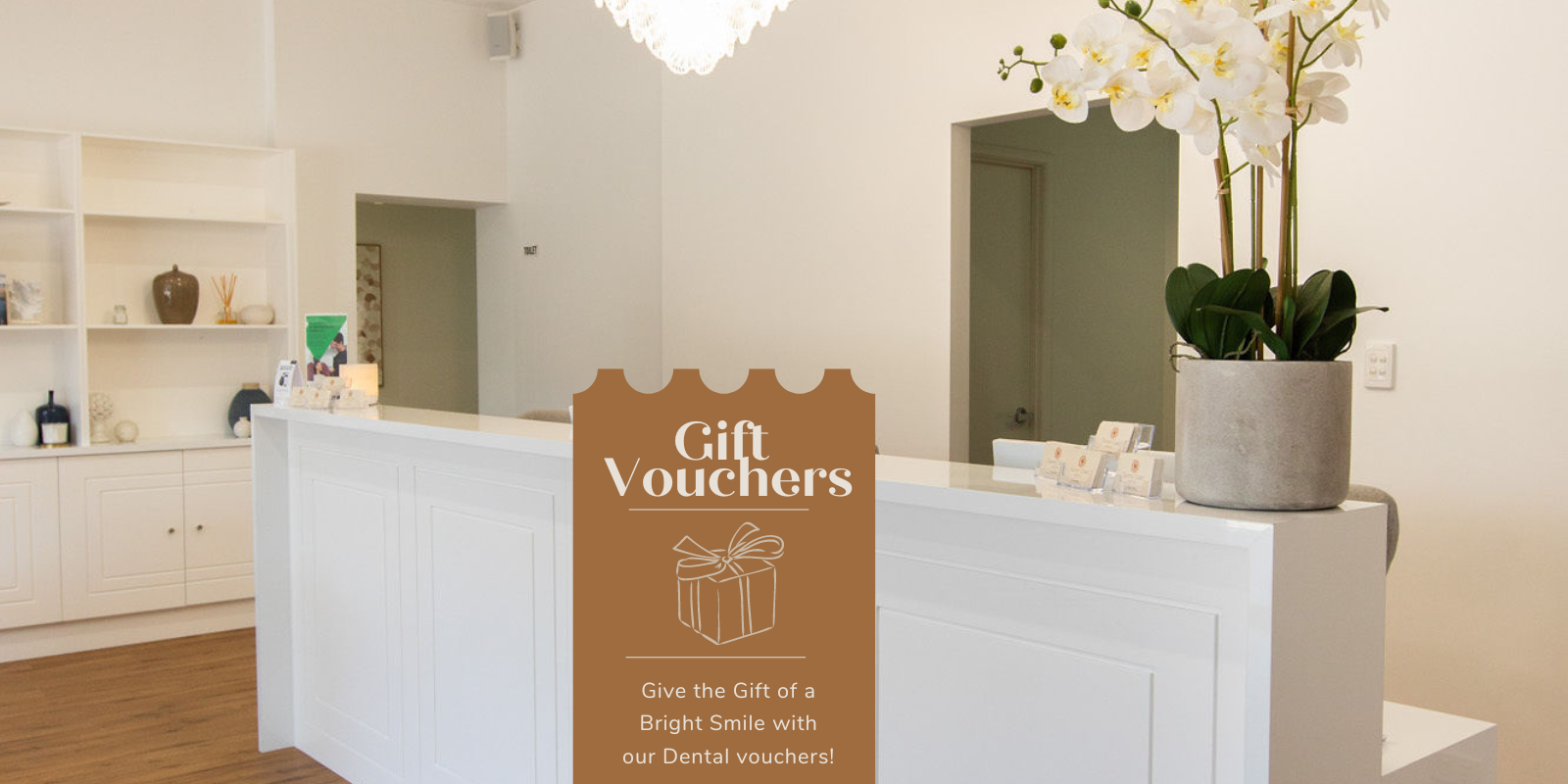 Photo of dental reception area with a gift voucher sign